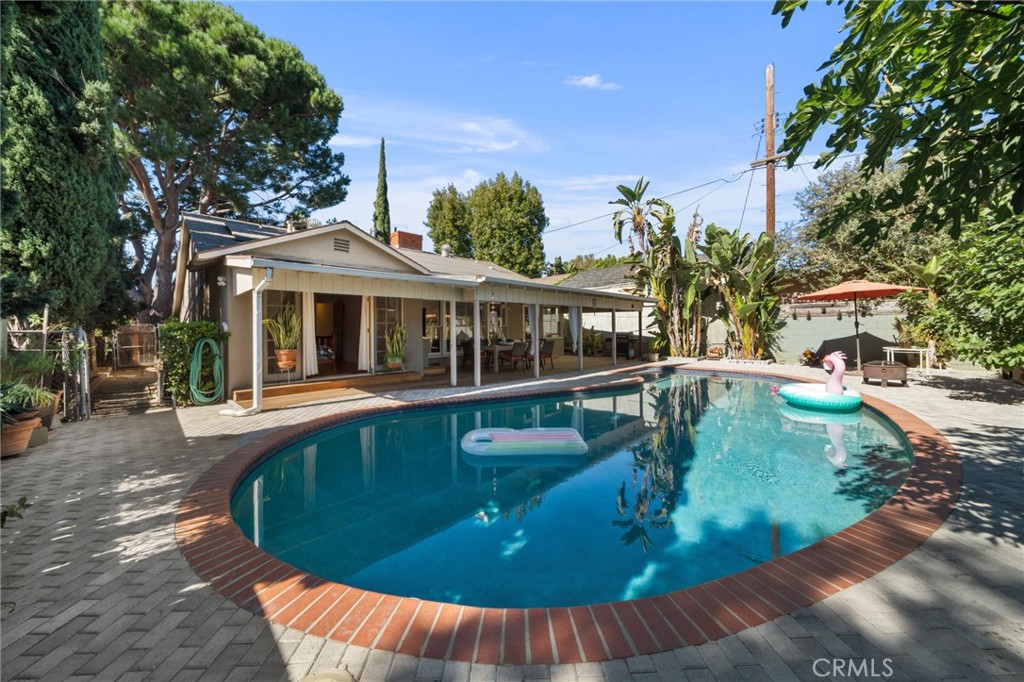 a view of a house with swimming pool