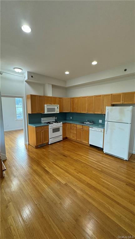 a view of kitchen with cabinets