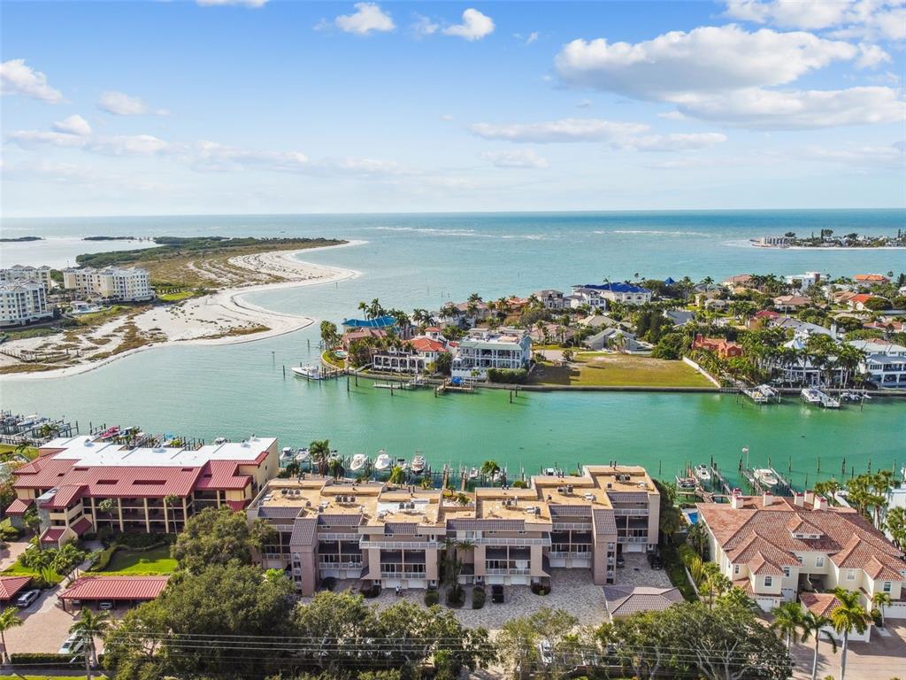 an aerial view of a city with lots of residential buildings lake and ocean view