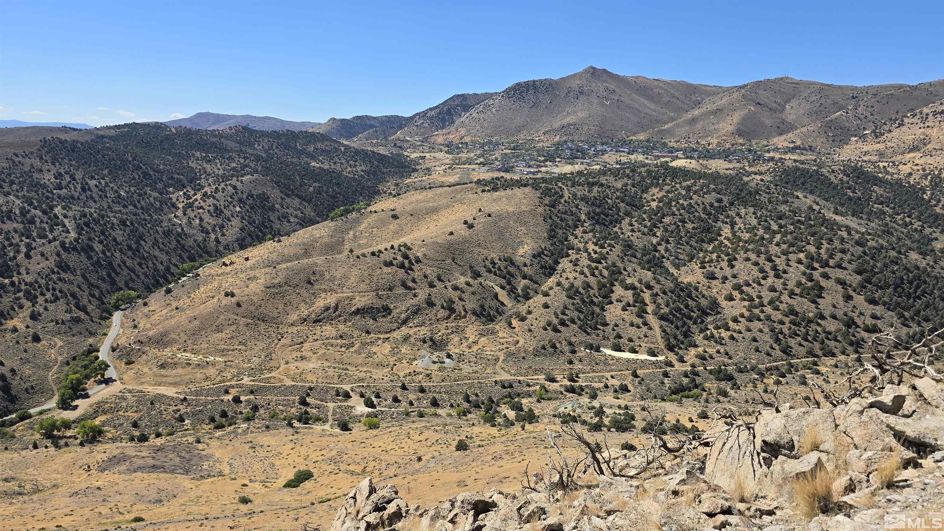 a view of a mountain with a mountain in the background