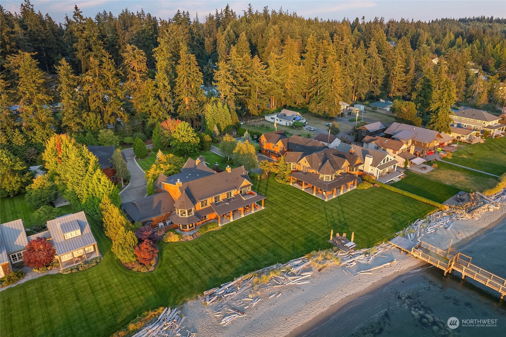 an aerial view of residential houses with outdoor space and street view