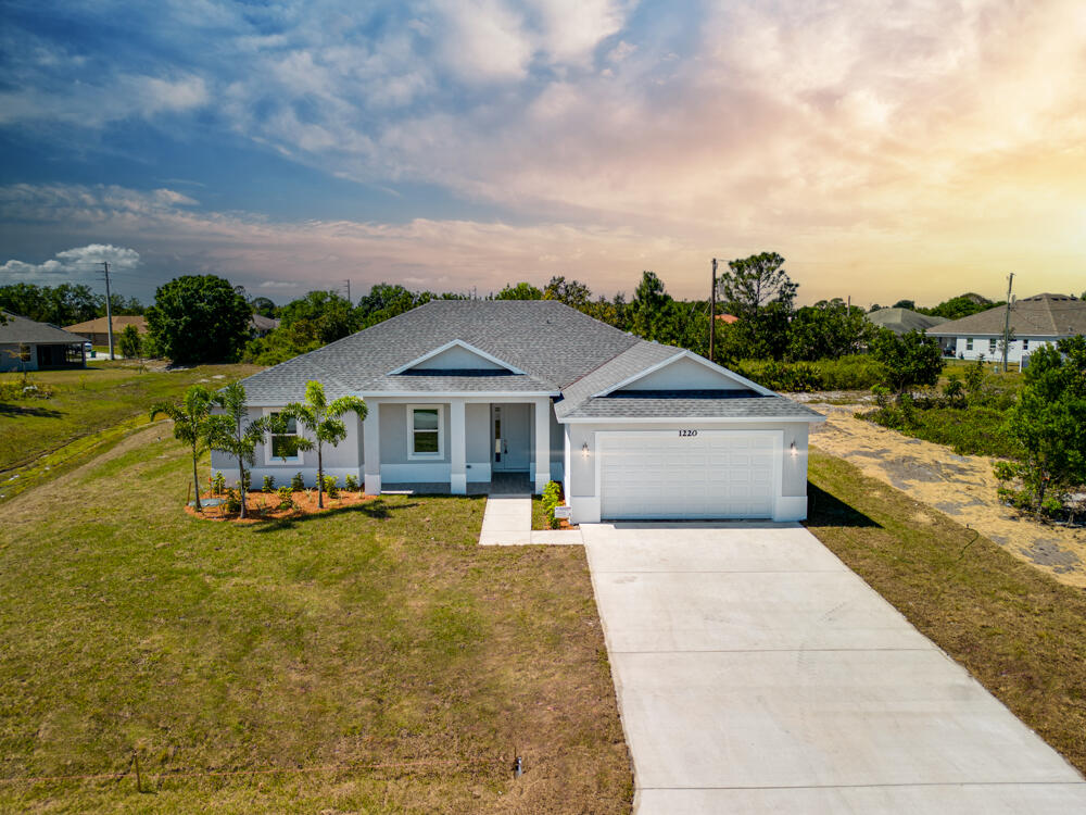 a view of a house with outdoor space and sitting area