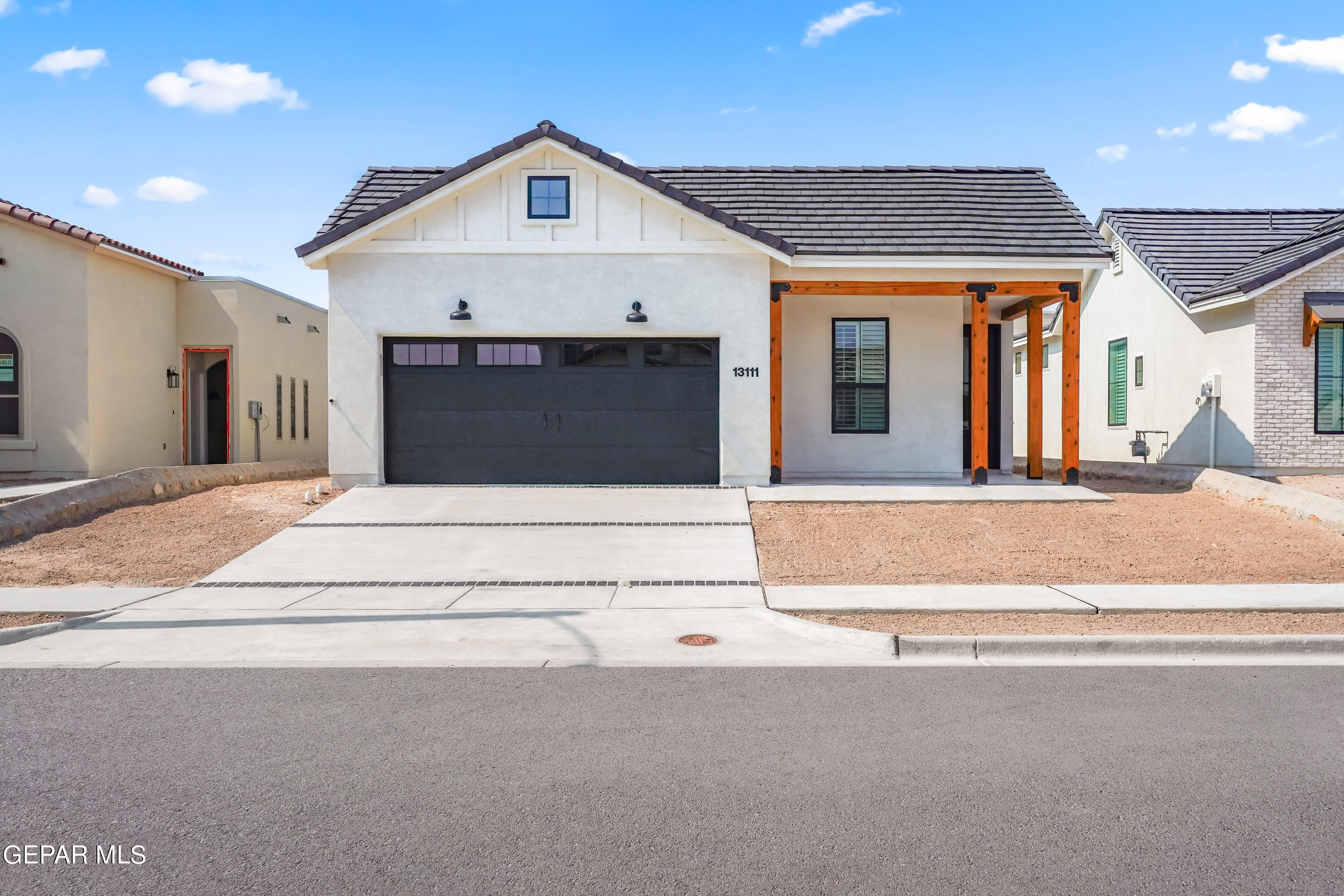 a front view of a house with a garage