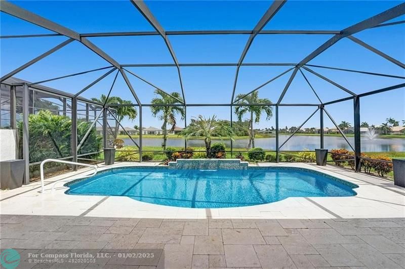 a view of a swimming pool with a lounge chairs