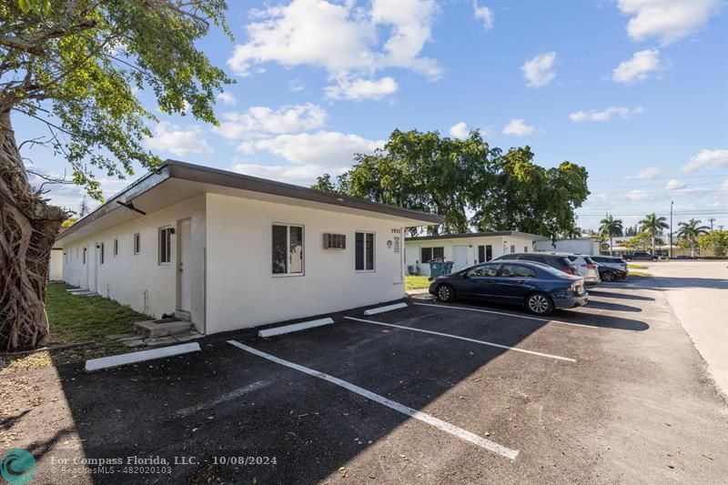 a view of a car park in front of house