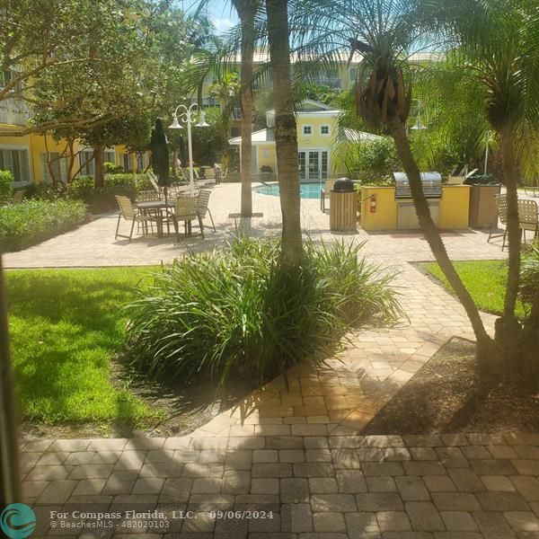 a view of a swimming pool with a patio