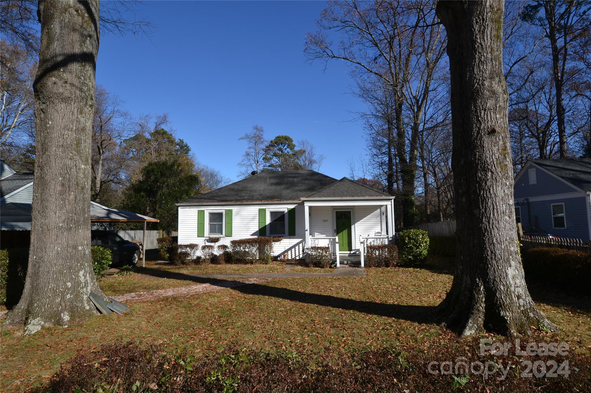 a view of a house with backyard porch and sitting area