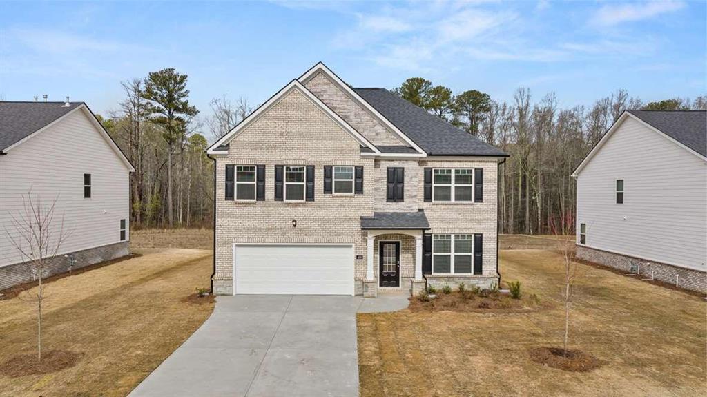 front view of a house with a yard