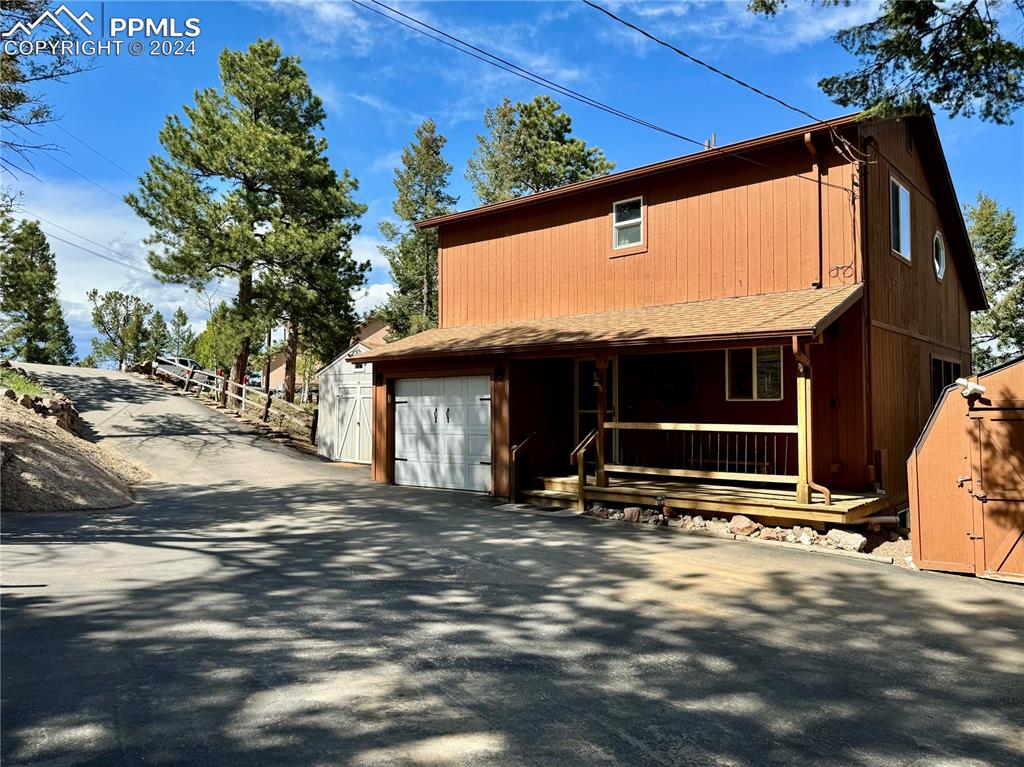 View of front of home featuring a garage