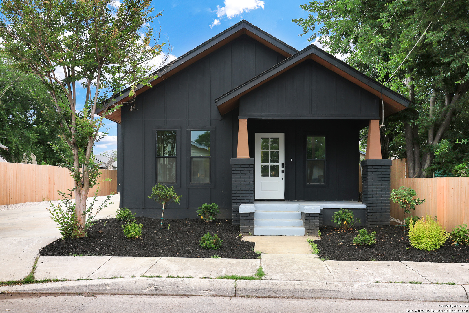 a front view of a house with garage