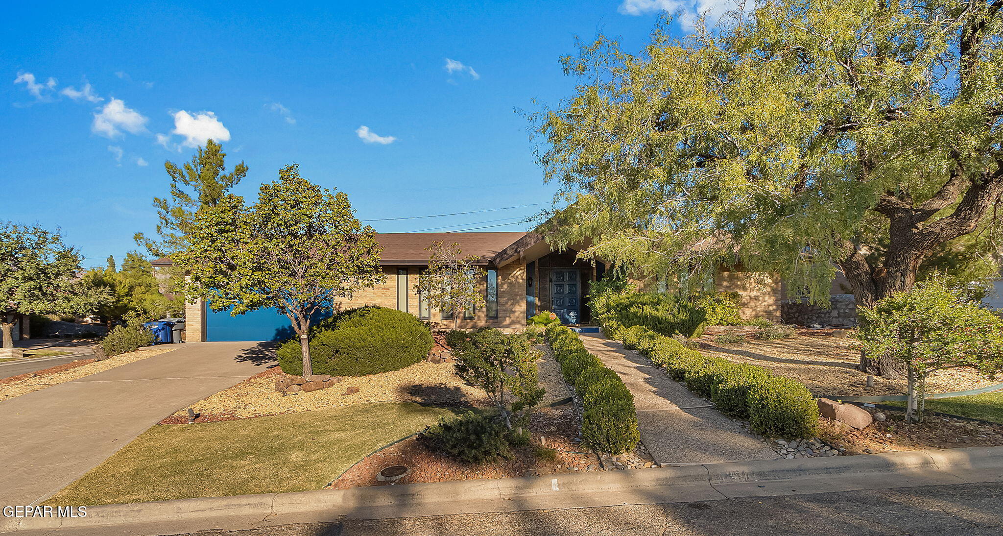 a view of a backyard of a house