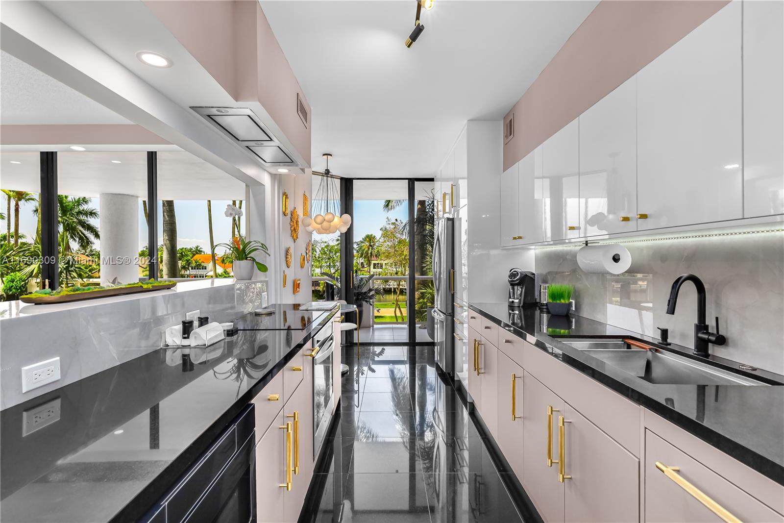 a large kitchen with granite countertop a large window and a sink