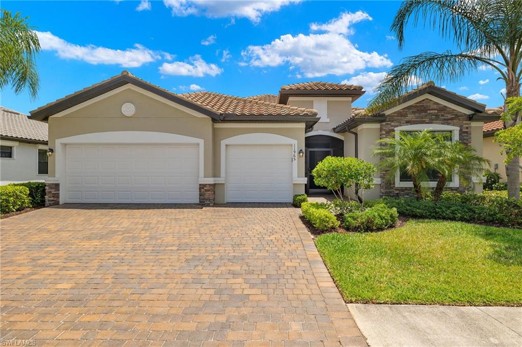 a view of a house with a yard and garage