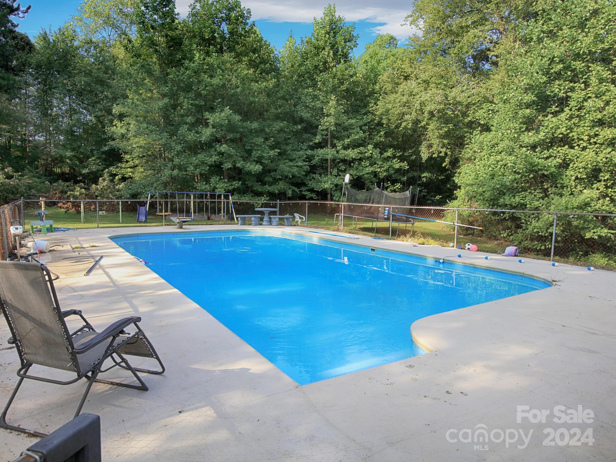 a view of a swimming pool with lounge chair