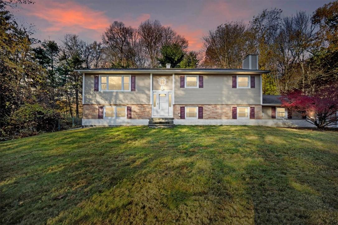 Split foyer home with a lawn