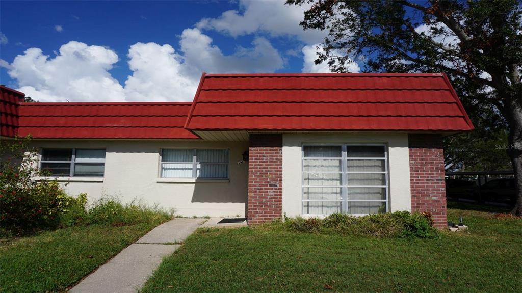 a front view of a house with garage