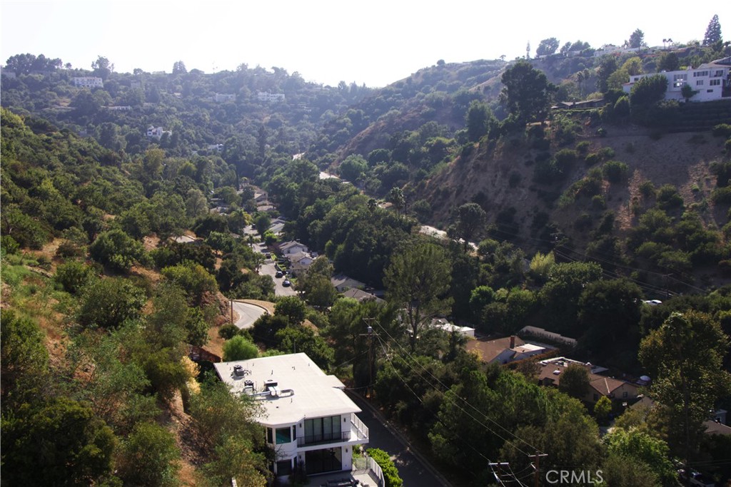 an aerial view of a house with mountain view