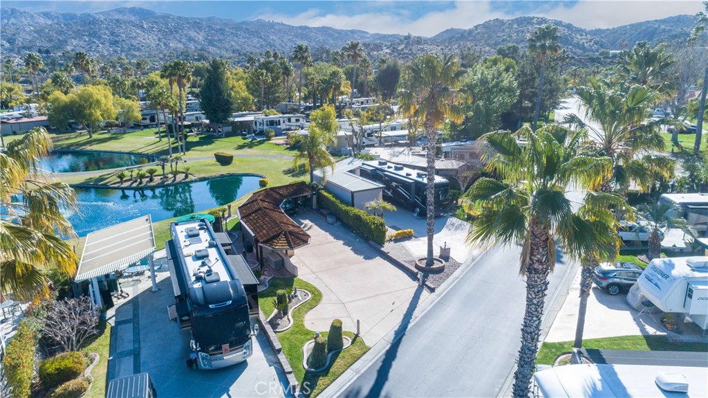 an aerial view of residential houses with outdoor space and swimming pool