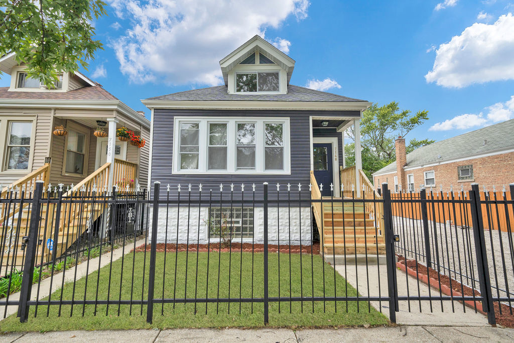 a view of a house with a iron gate