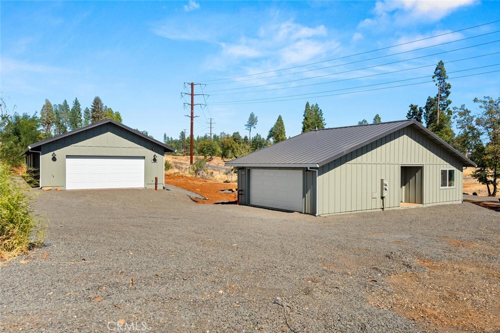 a view of a house with a yard and garage