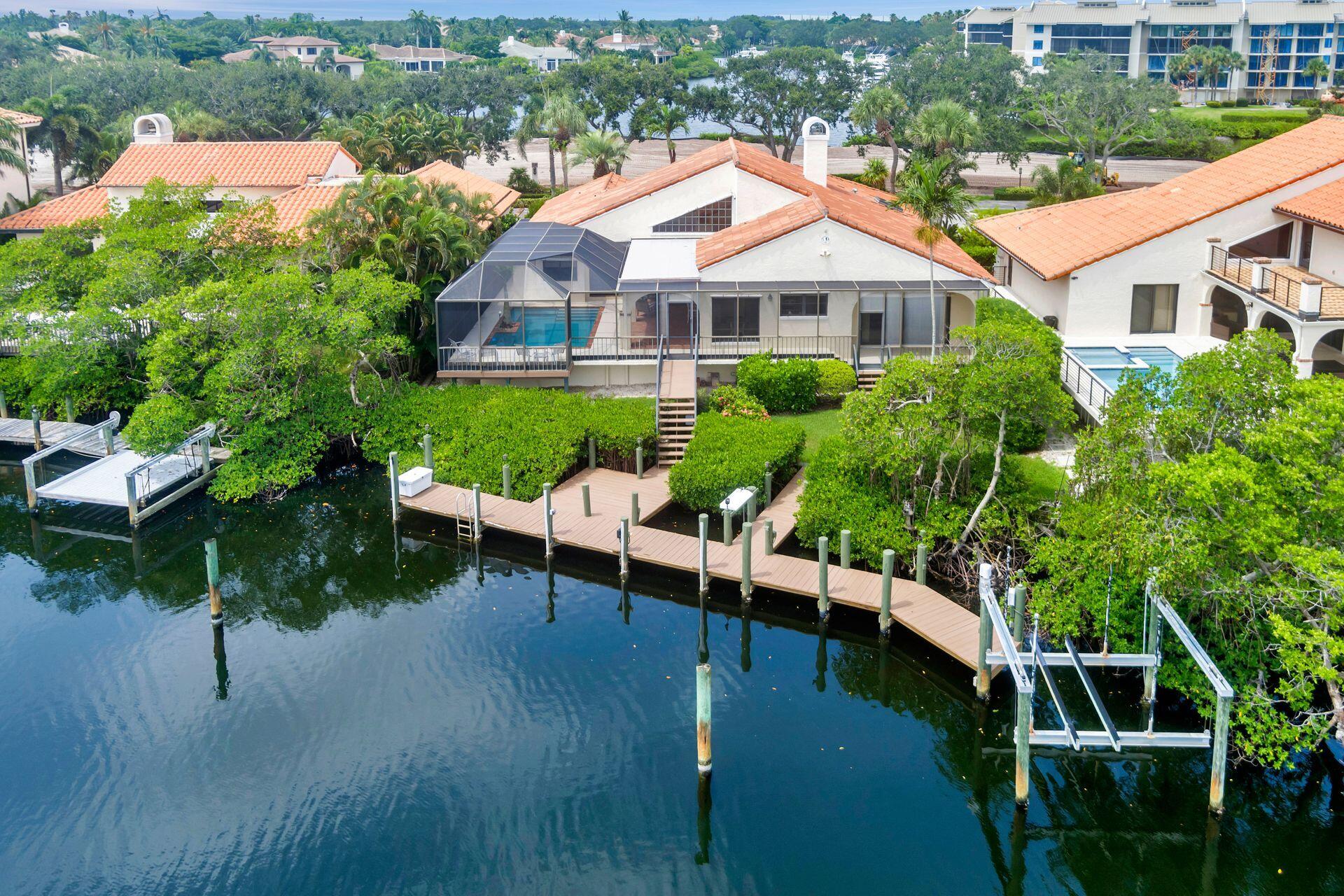 a view of a house with pool porch and sitting area