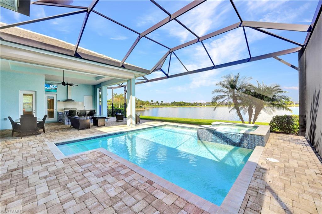 a swimming pool with outdoor seating