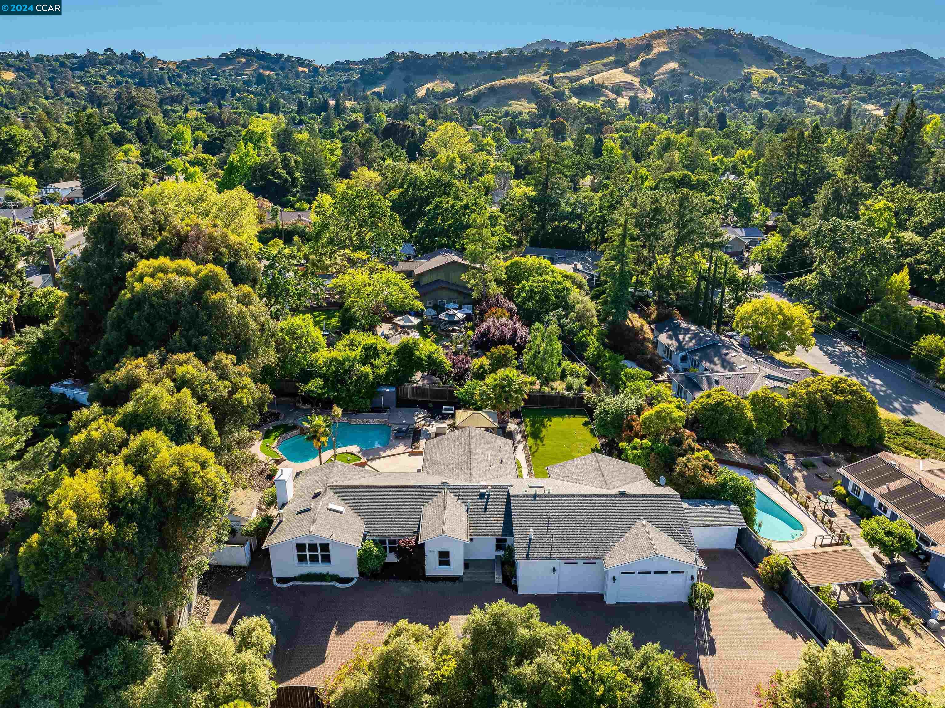 an aerial view of a house with a yard sitting space