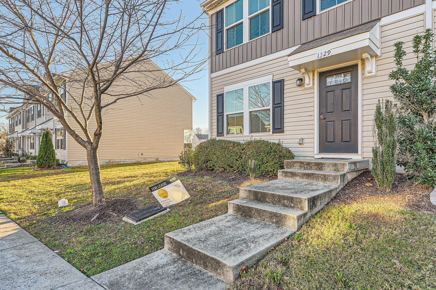 a view of house with backyard porch and sitting area