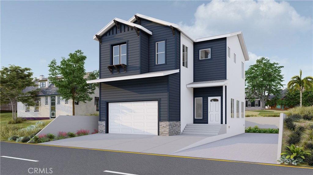 a front view of a house with a garden and garage