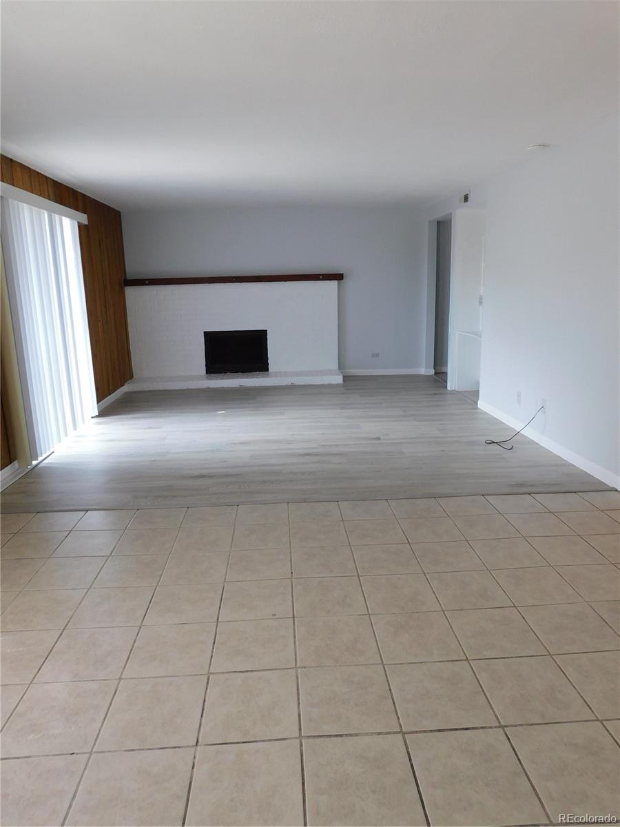 a view of empty room with window and stairs