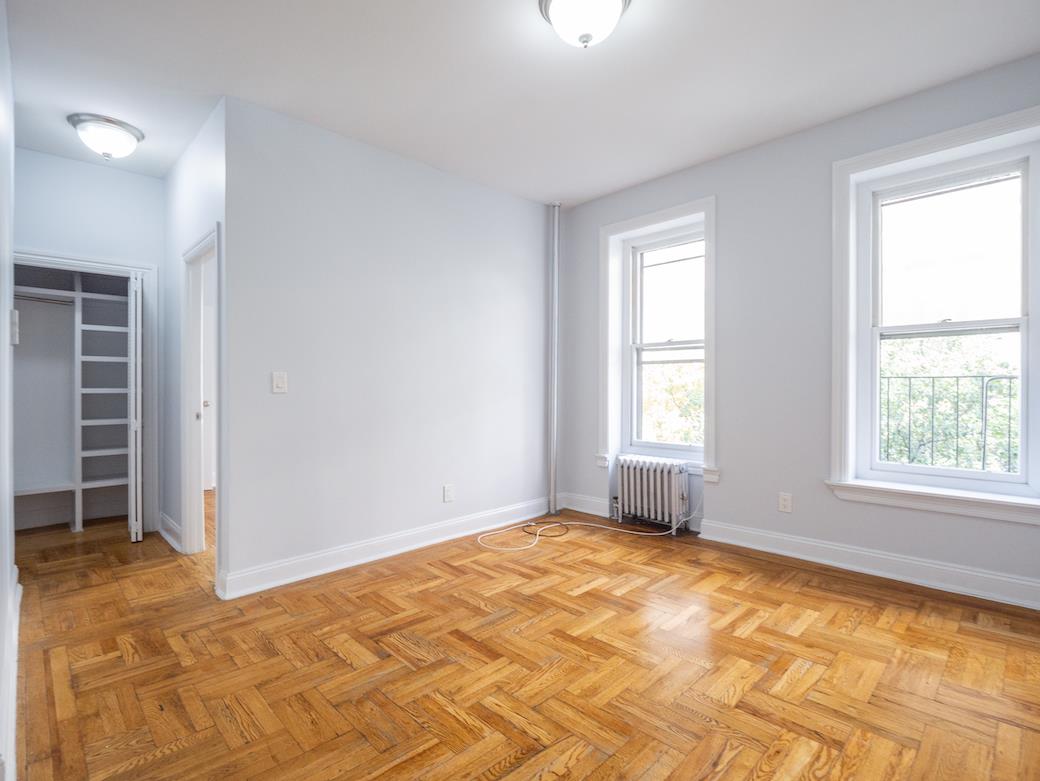 a view of an empty room with a window