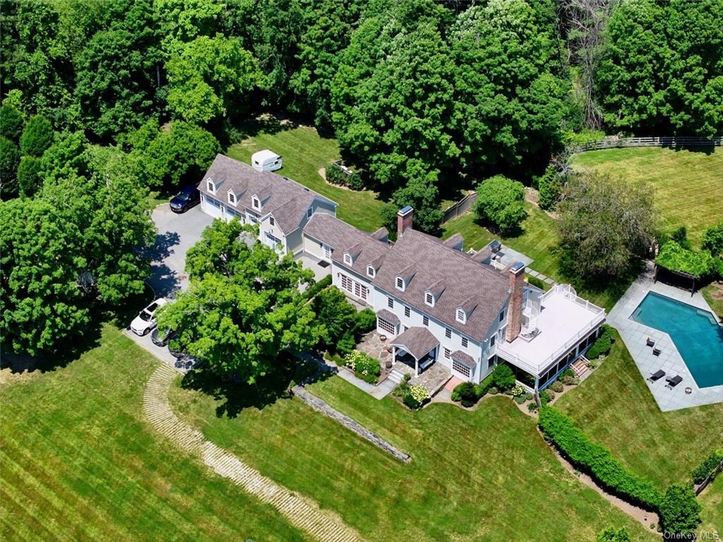 an aerial view of a house with a garden