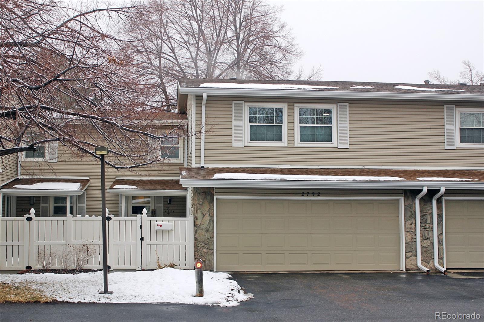 a view of a house with a garage