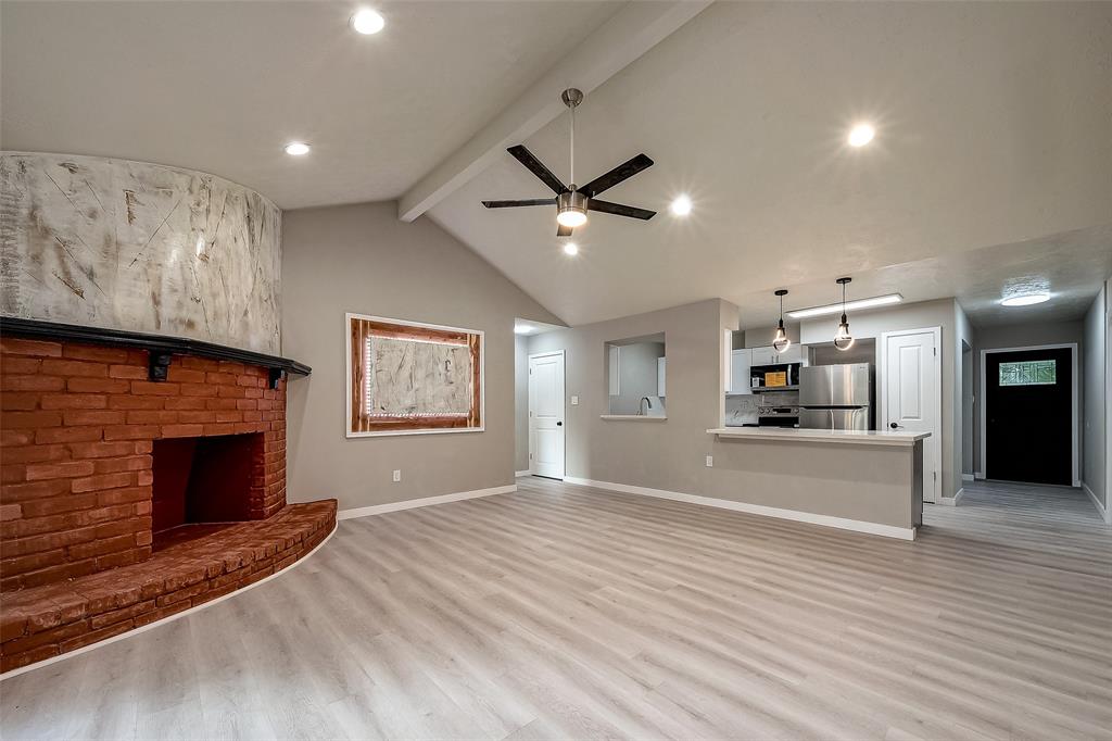 a view of kitchen with cabinets and wooden floor