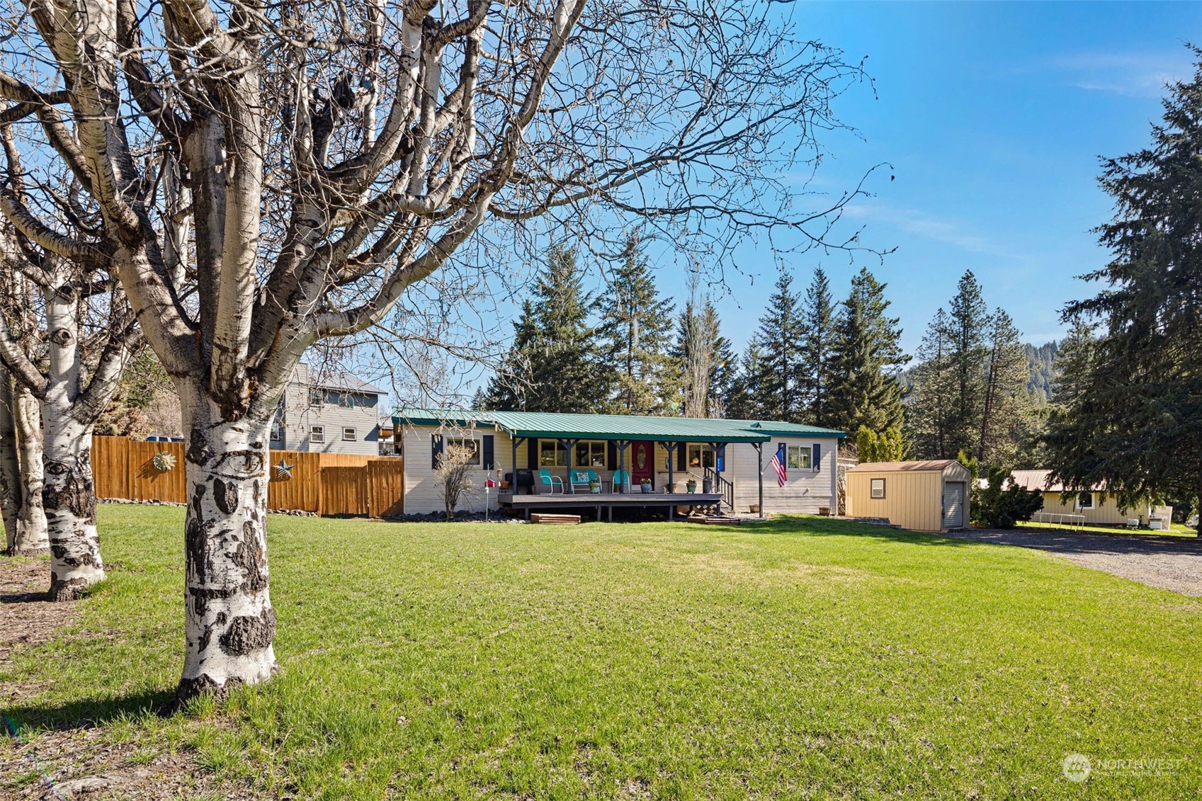 a view of a house with a yard and sitting area