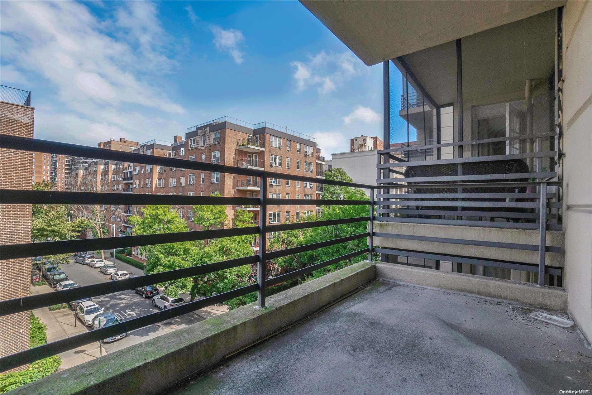 a view of a balcony with city view