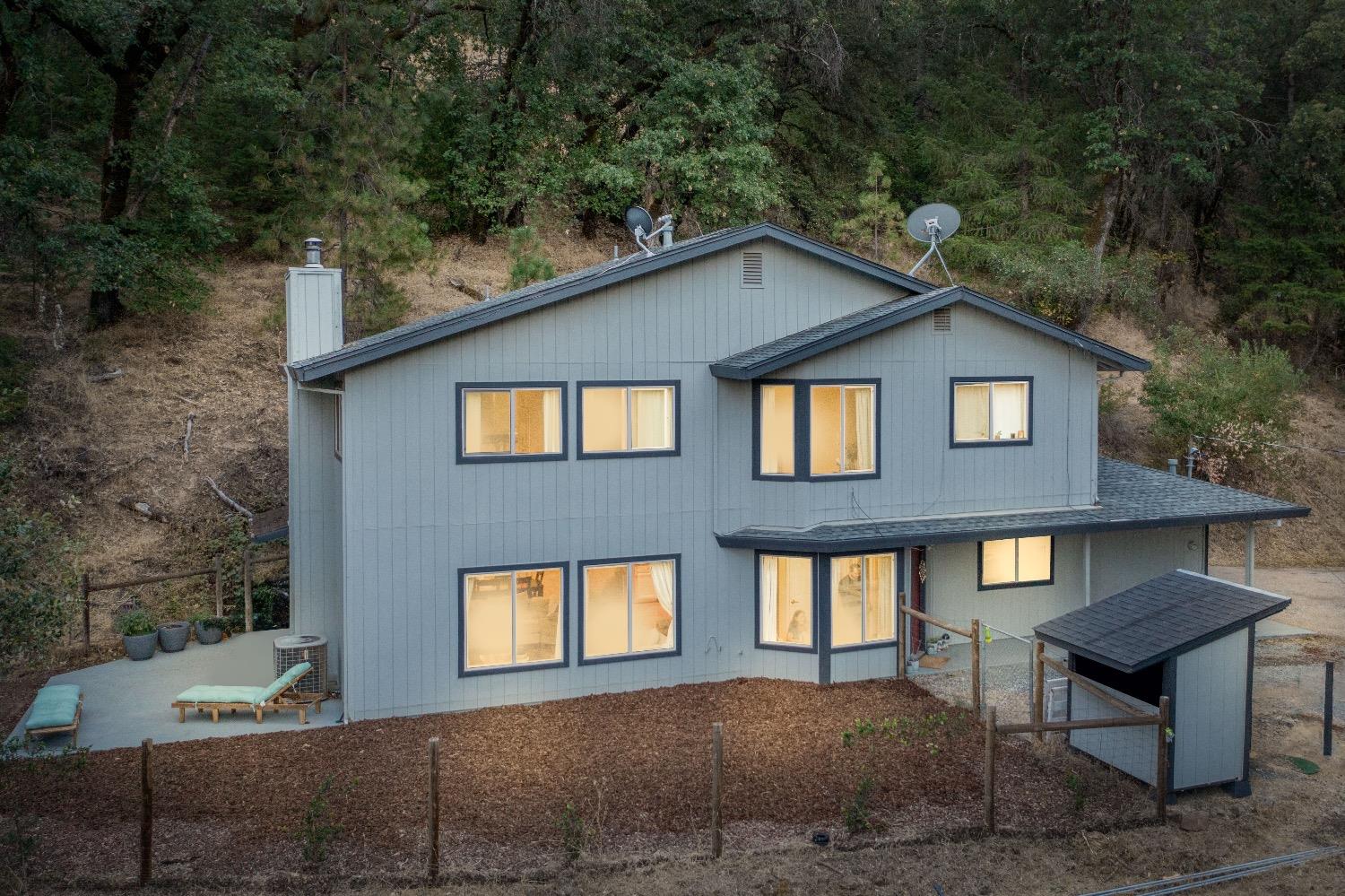 a front view of a house with yard