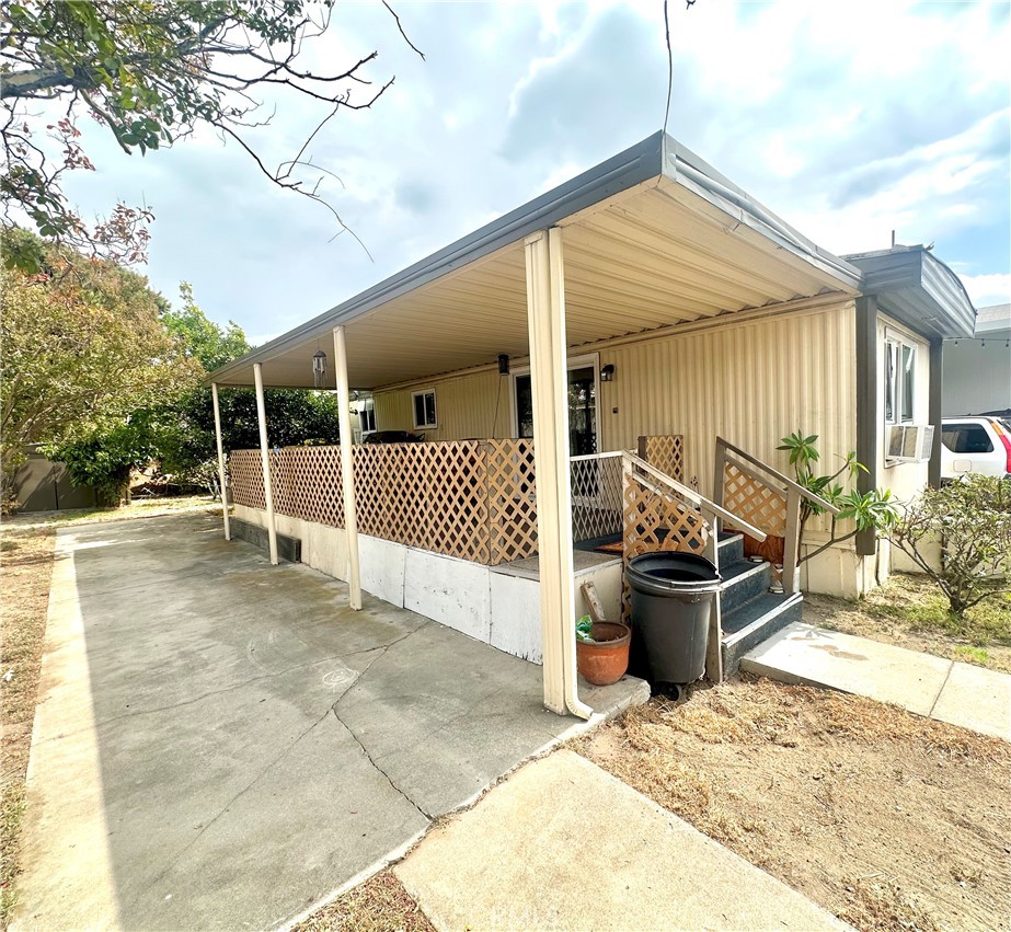 a view of a house with a wooden fence