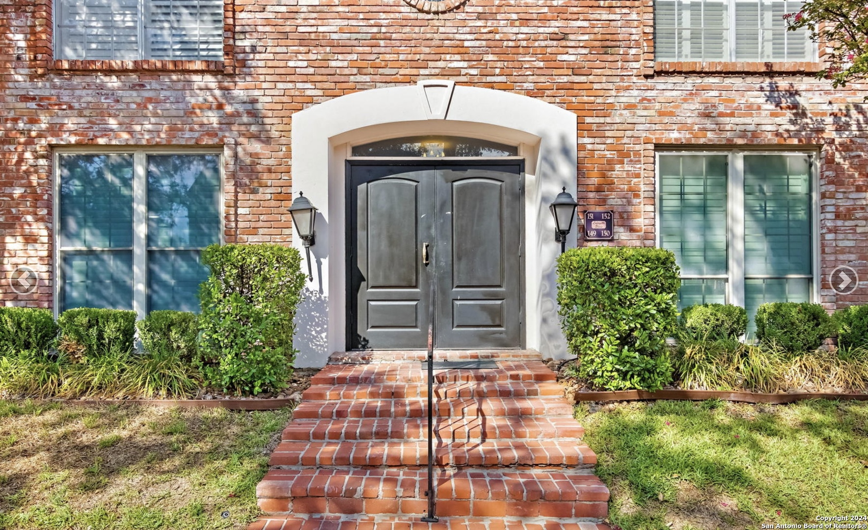 a view of house with front door and porch