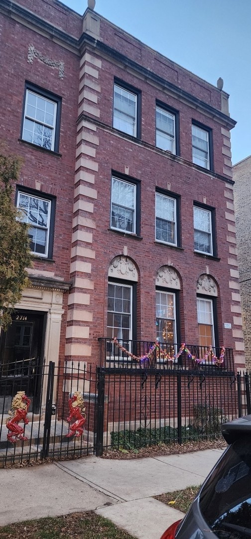 a red brick building that has lot of windows on it