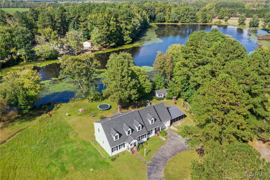 an aerial view of a house with a lake view