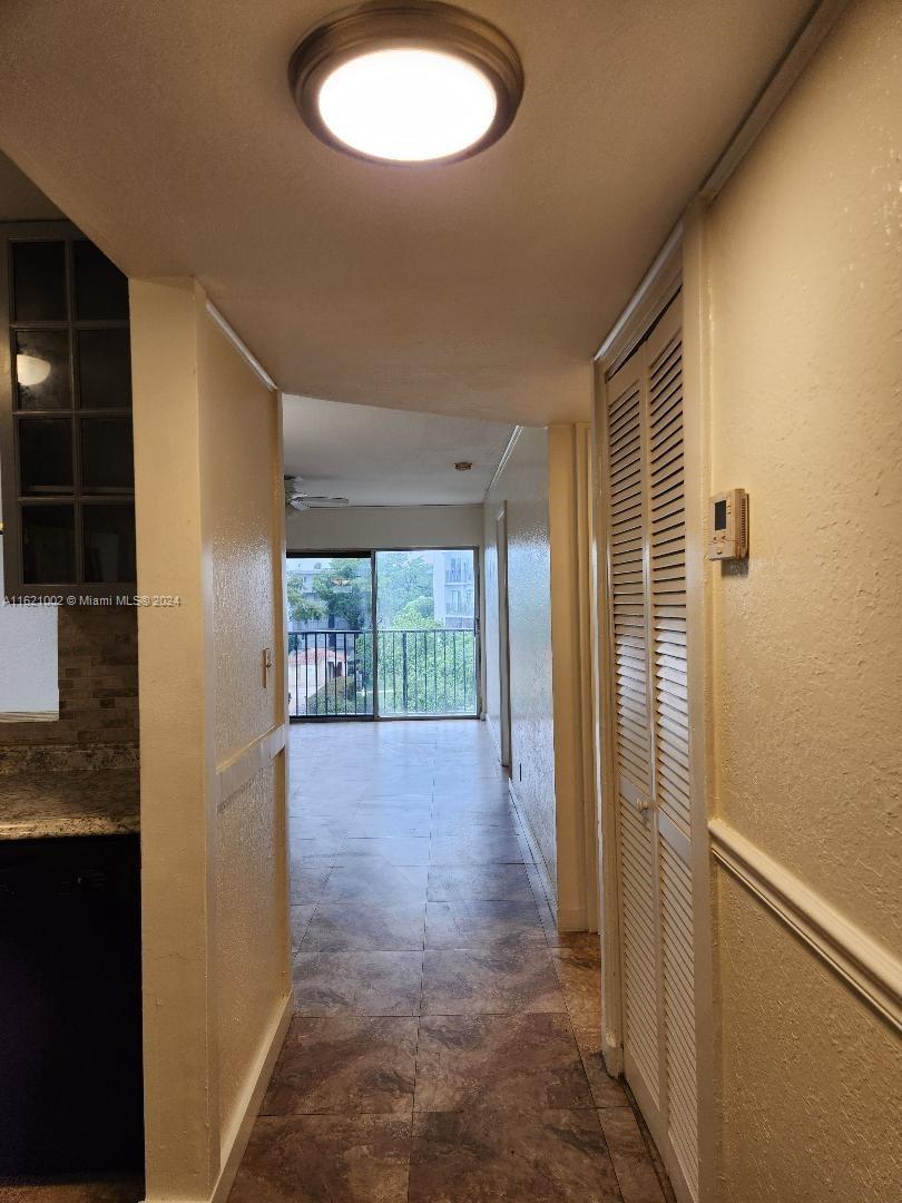 a view of hallway with windows