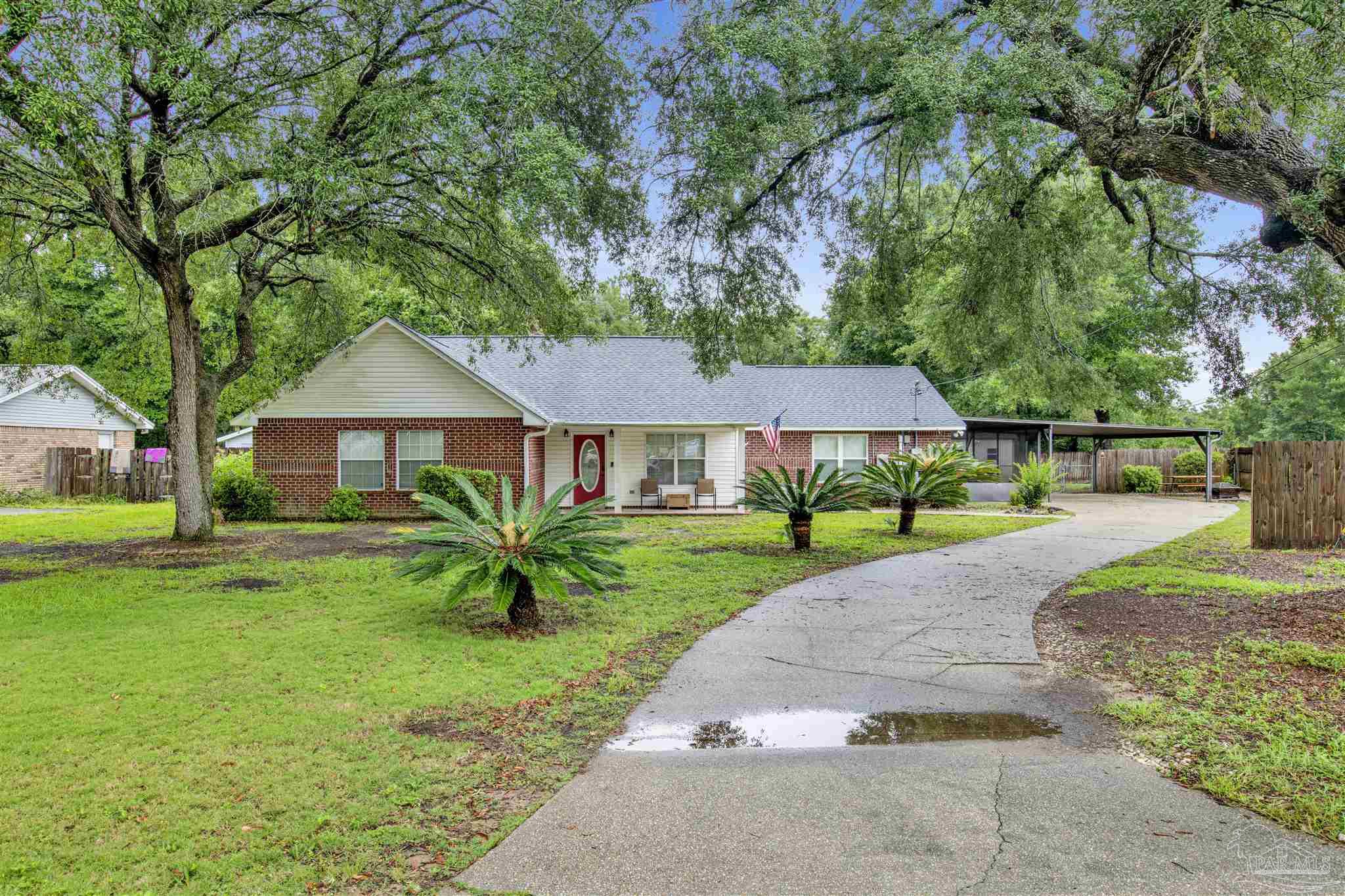 a front view of a house with a yard and porch