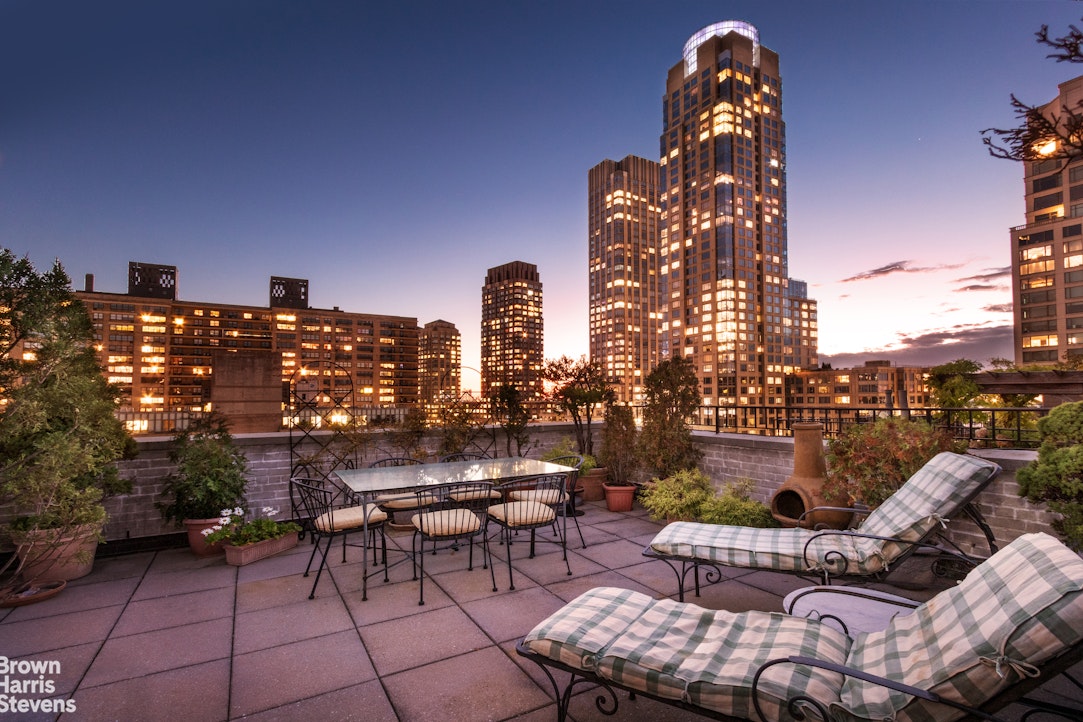 a roof deck view with patio