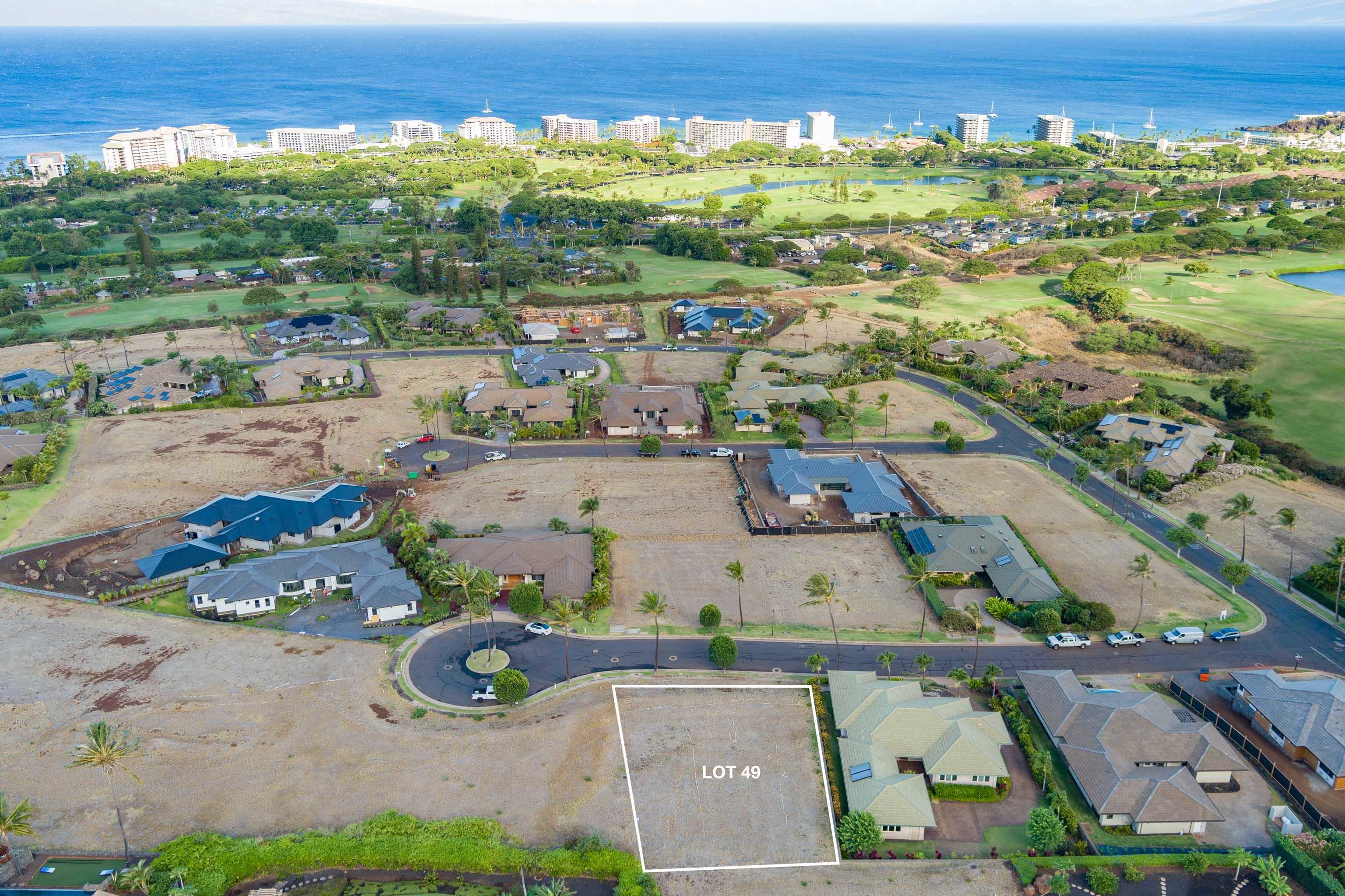 an aerial view of a house with a ocean view