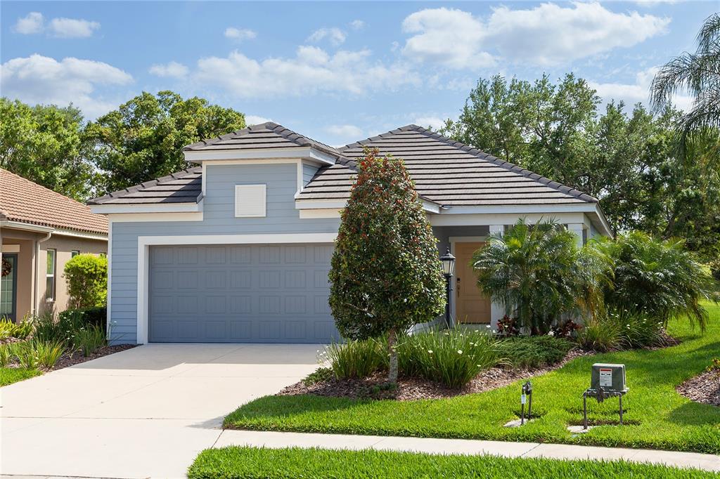 a front view of a house with garden