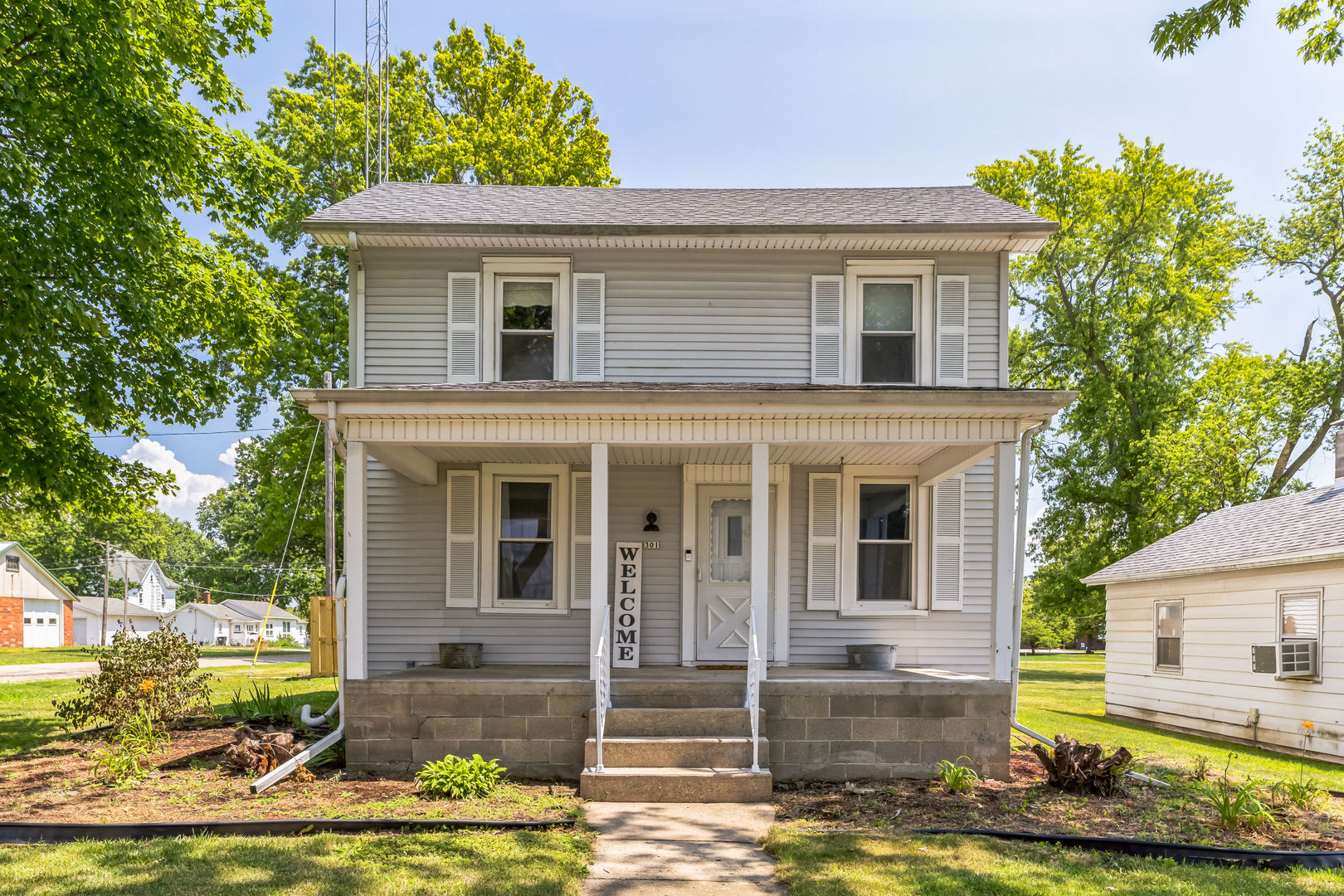 a front view of a house with garden