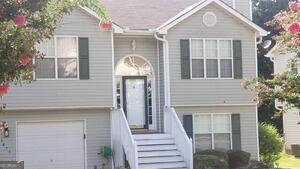 a front view of a house with a porch