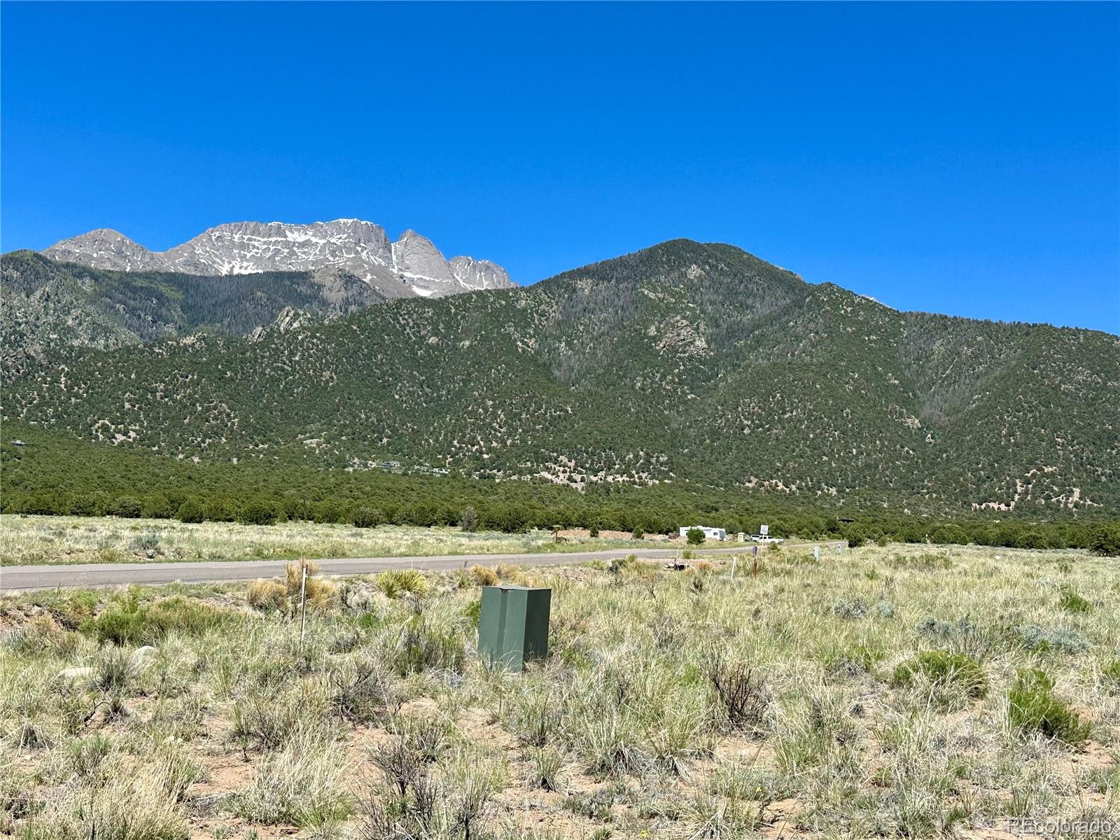 a view of a yard with a mountain