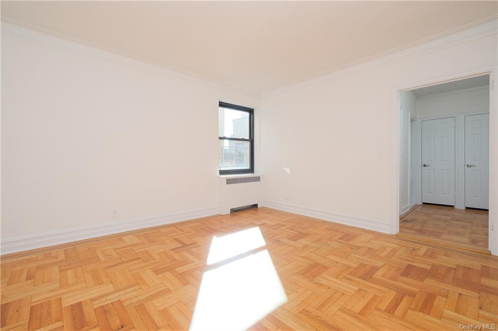 Main living space, sun-filled and looking west to Entry Hall.